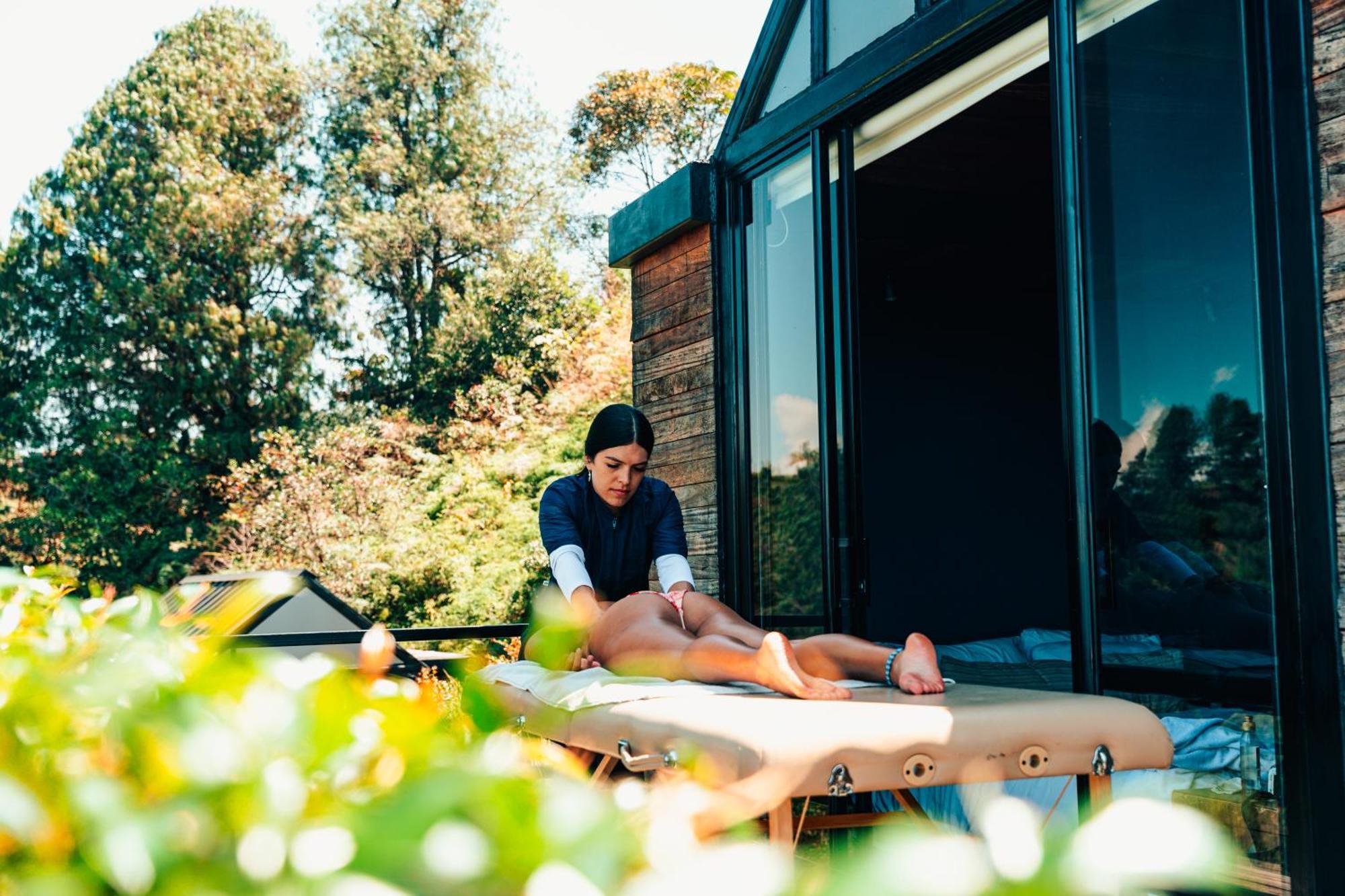 The Boato Hotel Guatapé 외부 사진 A massage therapist treating a client